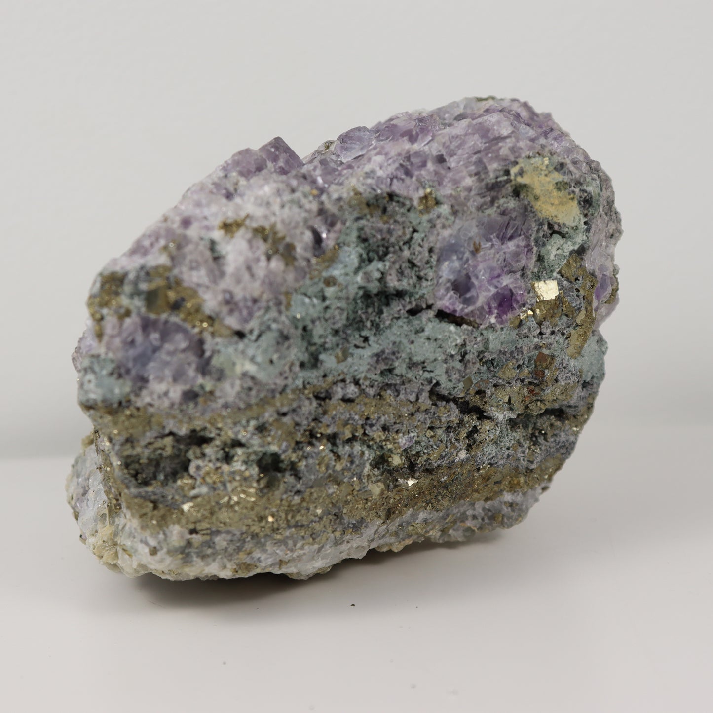 Pyrite Specimen with Clear Quartz and Amethyst Inclusions