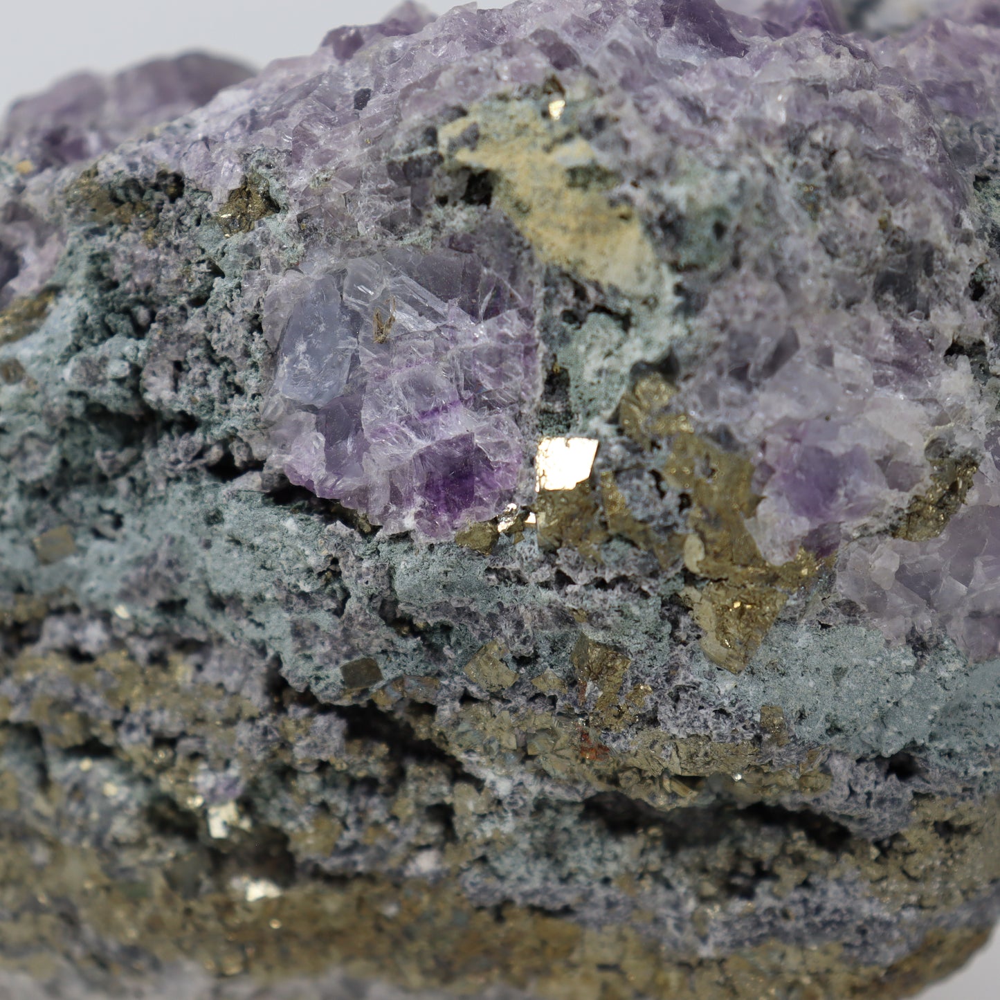 Pyrite Specimen with Clear Quartz and Amethyst Inclusions