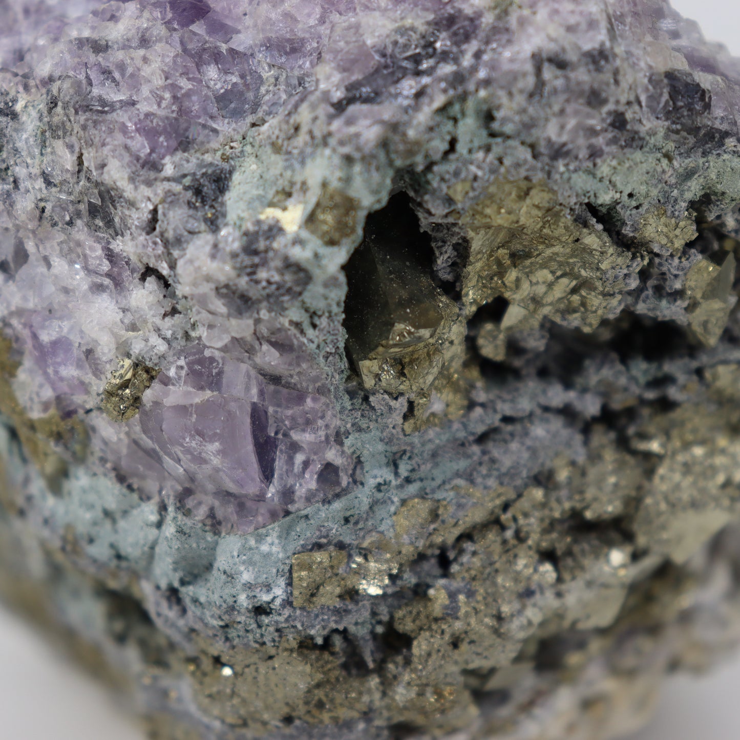 Pyrite Specimen with Clear Quartz and Amethyst Inclusions