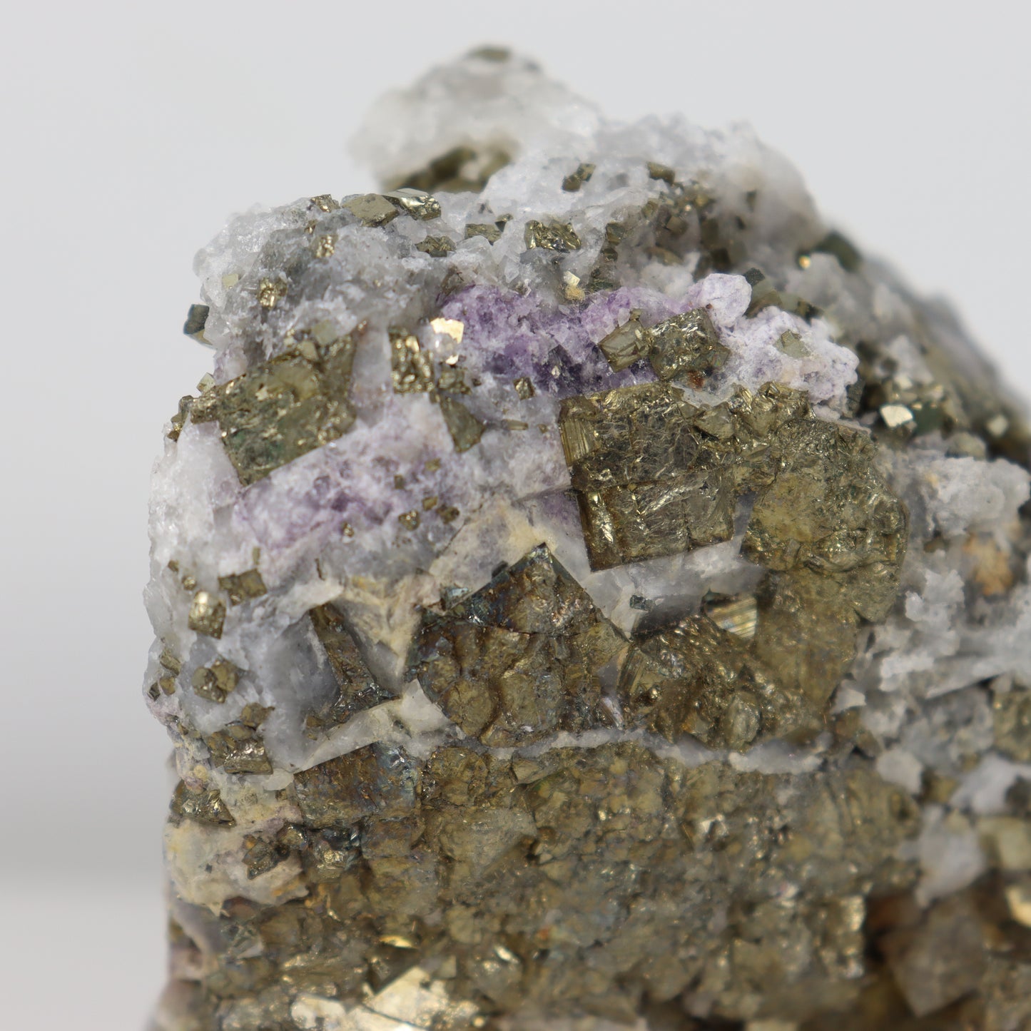 Pyrite Specimen with Clear Quartz and Amethyst Inclusions