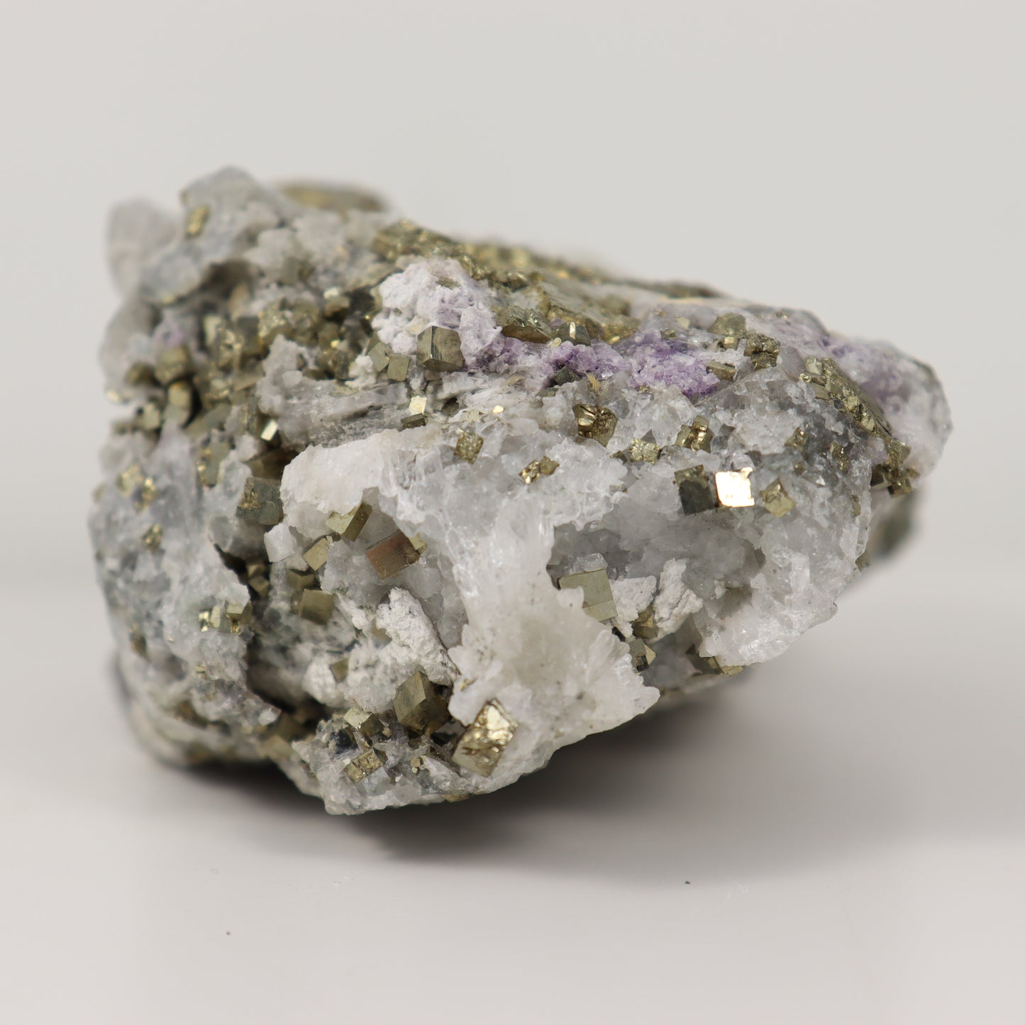 Pyrite Specimen with Clear Quartz and Amethyst Inclusions